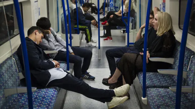 People sleep on the London underground