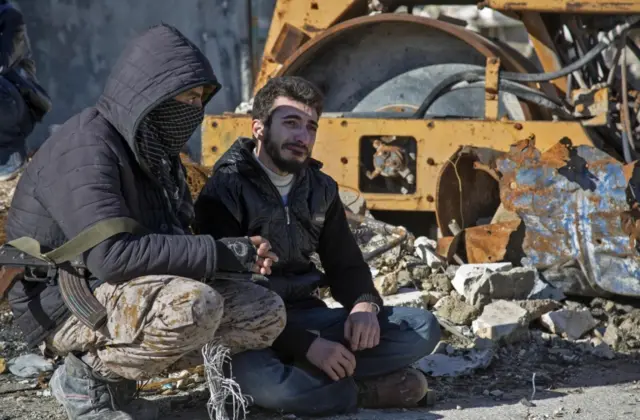 A Syrian man cries during an evacuation operation of rebel fighters and their families from rebel-held neighbourhoods of Aleppo