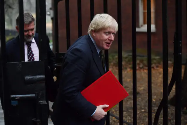 British Foreign Secretary Boris Johnson arrives for the weekly meeting of the cabinet at 10 Downing Street in central London on December 13, 2016