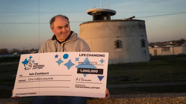 Iain Cockburn with his cheque