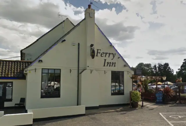 A side view of the Ferry Inn, and carpark