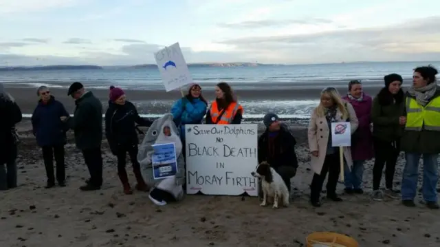 The protestors gathered on Nairn beach on Sunday