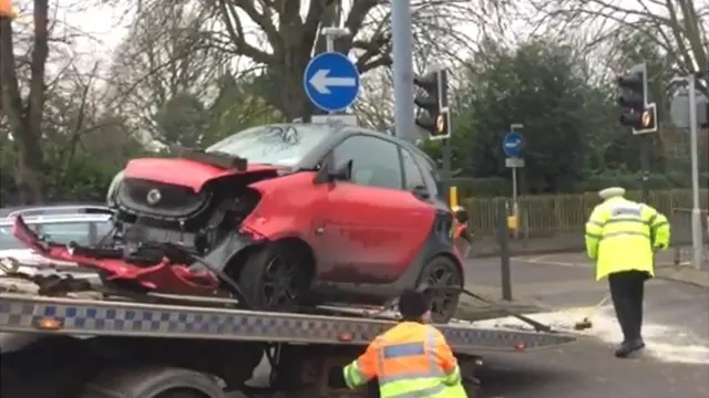 One of the damaged cars being recovered