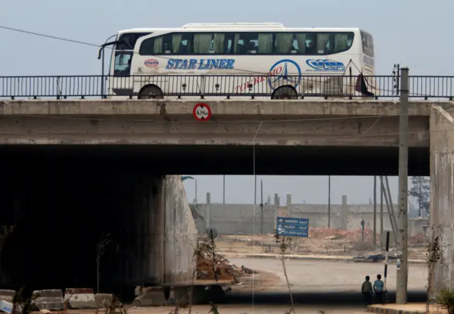 Bus travelling back to east Aleppo after evacuations halted