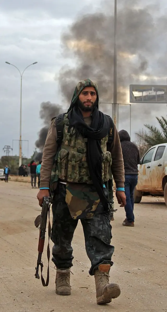 Syrian rebel fighters and civilians who were evacuated from rebel-held neighbourhoods in the embattled city of Aleppo arrive in the opposition-controlled Khan al-Aassal region, west of the embattled city, on December 16, 2016. T