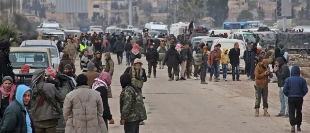 Syrian rebel fighters and civilians who were evacuated from rebel-held neighbourhoods in the embattled city of Aleppo arrive in the opposition-controlled Khan al-Aassal region, west of the embattled city, on December 16, 2016.