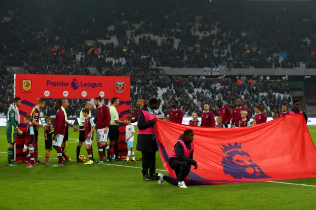 Teams shake hands at the London Stadium