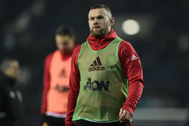 Wayne Rooney warms up