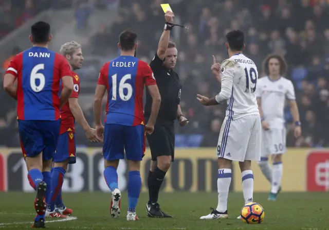 Jon Moss hands out a yellow card