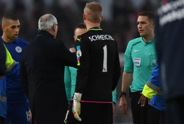 Leicester players surround the ref