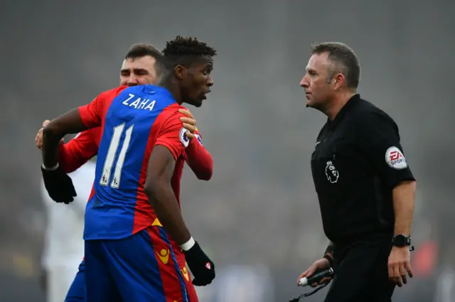 Zaha and Referee Jon Moss