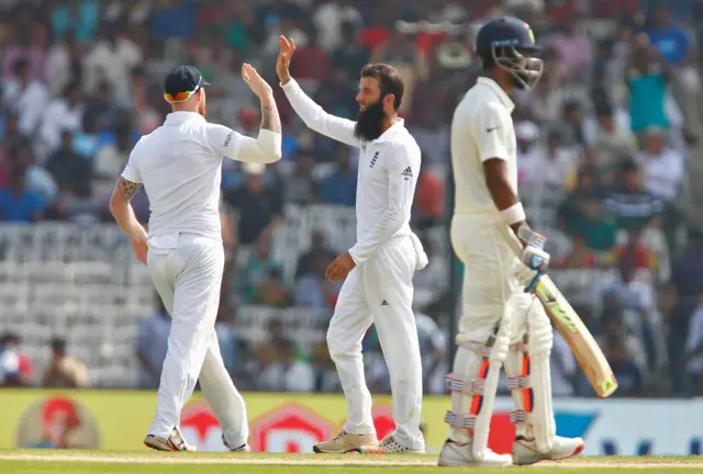 England celebrate the wicket of Patel