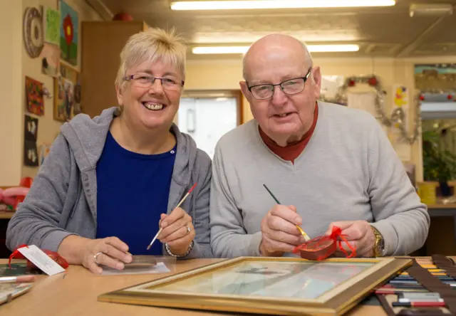 Trish Abbott and husband Phil making the little gifts