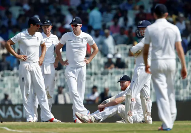 Players await umpire's decision