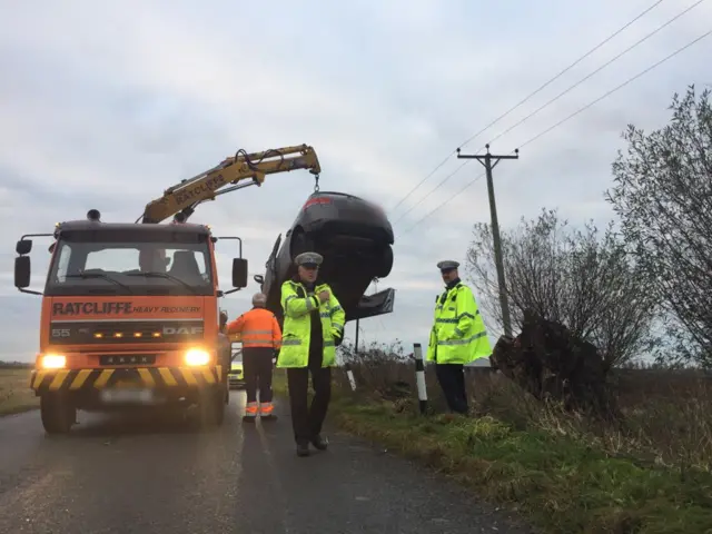 Car being lifted after collision