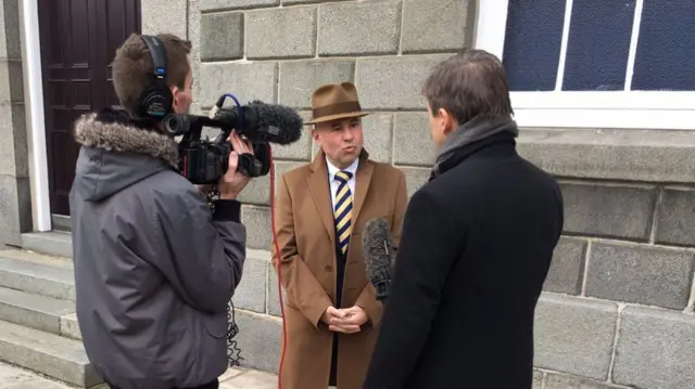 Carl Meerveld being interviewed by the BBC on the steps of the States