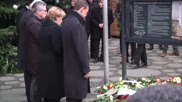 Merkel laying flowers