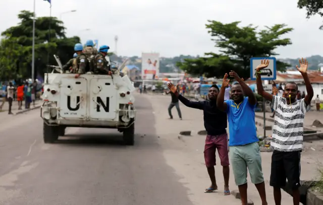 Residents chant slogans against Congolese President Joseph Kabila as peacekeepers serving in the United Nations Organization Stabilization Mission in the Democratic Republic of the Congo (MONUSCO) patrol during demonstrations in the streets of the Democratic Republic of Congo"s capital Kinshasa, December 20, 2016.