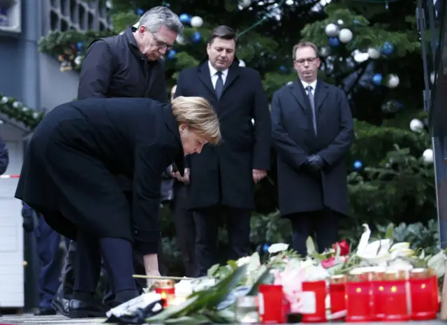 Angela Merkel lay flowers