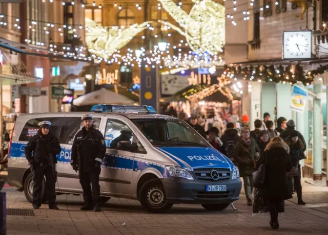 Armed police officers on patrol at a Christmas market in Wiesbaden, Germany