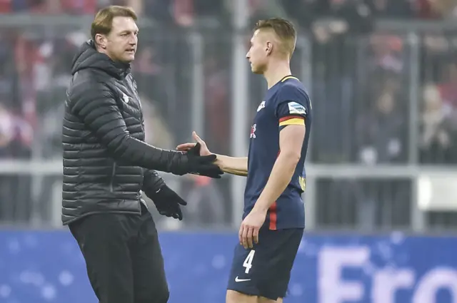 Ralph Hasenhuettl and Leipzig's defender Willi Orban