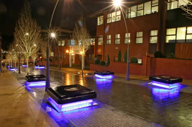 City ctreet seating with lights round the base