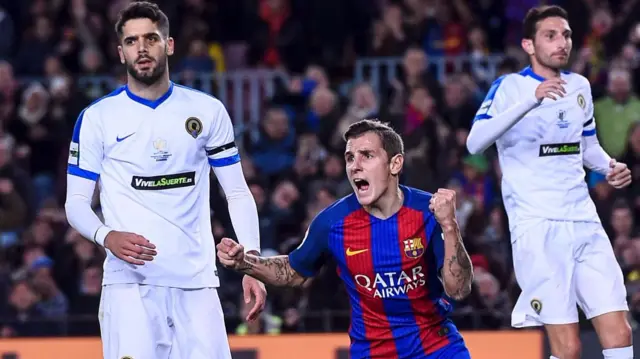 Lucas Digne (C) celebrates after scoring