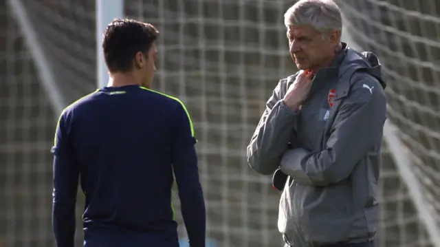 Arsene Wenger with Mesut Ozil