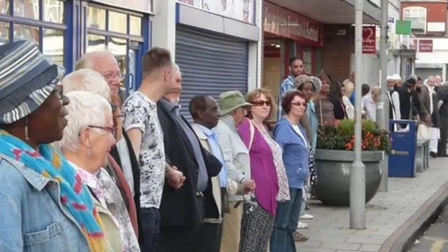 People line the high street in Erdington