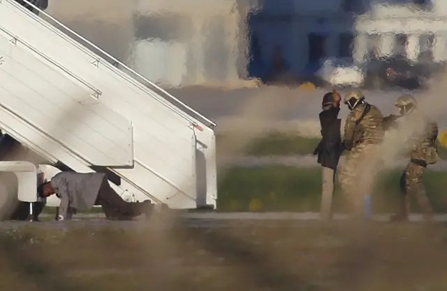 wo hijackers of a Libyan Afriqiyah Airways Airbus A320 surrender to Maltese military on the runway at Malta Airport, December 23, 2016.