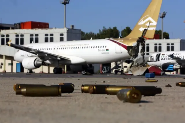 A picture taken on August 26, 2014, shows bullet casing and damaged airplanes on the tarmac at Tripoli international airport in the Libyan capital after fighters from the Fajr Libya (Libyan Dawn) coalition captured the airport from Zintan force, allies of rogue general Khalifa Haftar.