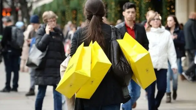 Shoppers in a high street