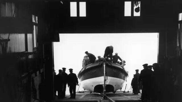 December 1928: The lifeboat HF Bailey II enters the new boathouse at Cromer beach.