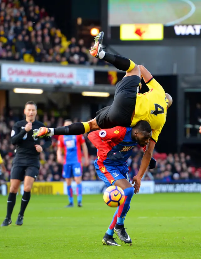 Younes Kaboul jumps for the ball