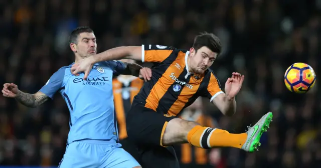 Aleksandar Kolarov in action with Hull City"s Harry Maguire