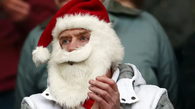 Stoke City fan in a santa hat