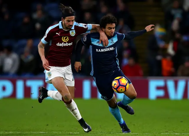 Fabio Da Silva of Middlesbrough holds off pressure from George Boyd of Burnley