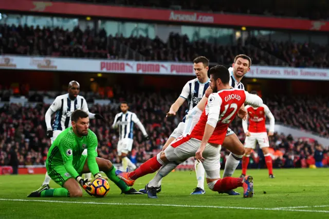 Ben Foster of West Bromwich Albion claims the ball as Olivier Giroud of Arsenal stretches to reach it