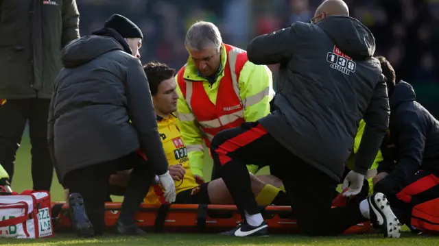 Watford's Daryl Janmaat is stretchered off