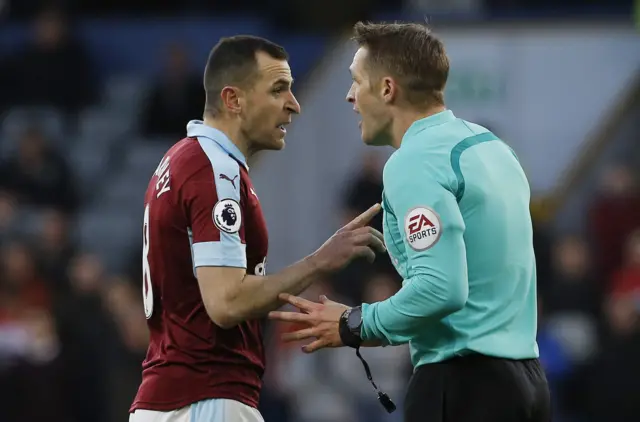 Dean Marney of Burnley with the referee