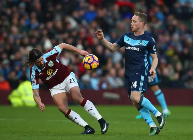 George Boyd of Burnley and Adam Forshaw of Middlebrough battle for a loose ball