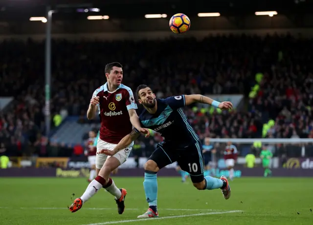 Alvaro Negredo of Middlesbrough holds off pressure from Michael Keane of Burnley