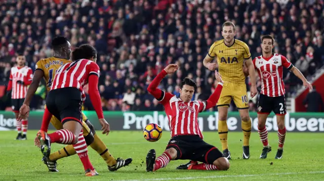 Vincent Wanyama of Tottenham Hotspur sees his shot blocked