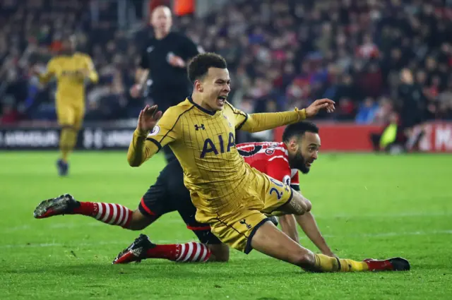 Nathan Redmond of Southampton fouls Dele Alli