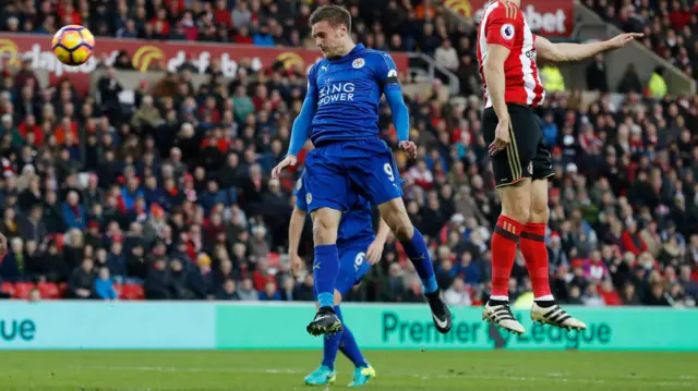 Jamie Vardy heads at goal