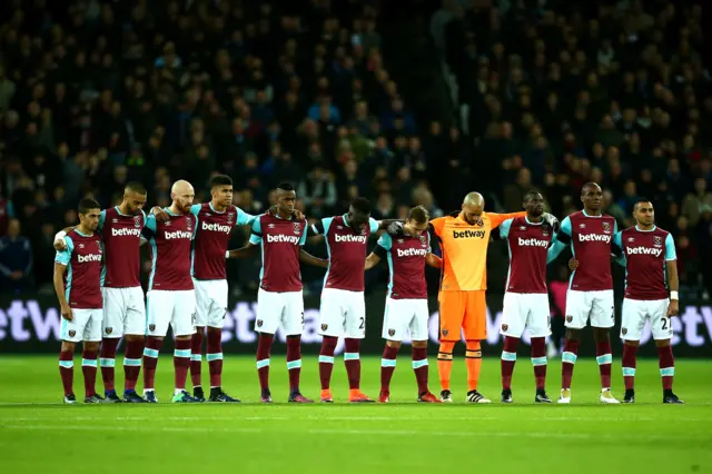 West Ham United players observe a minutes silence