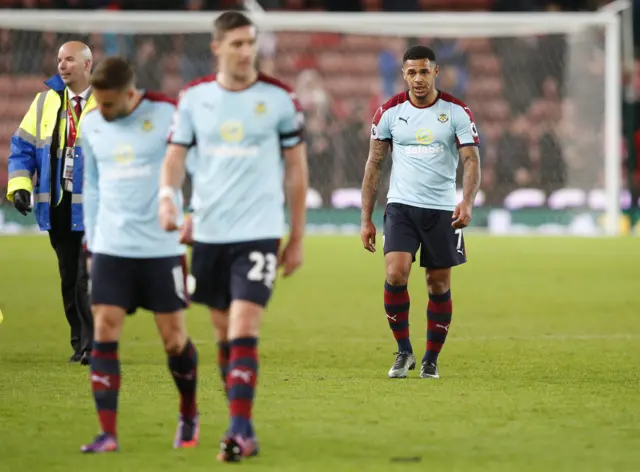 Burnley players leave the pitch