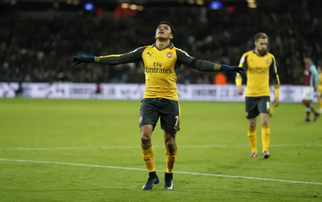 Alexis Sanchez celebrates scoring their third