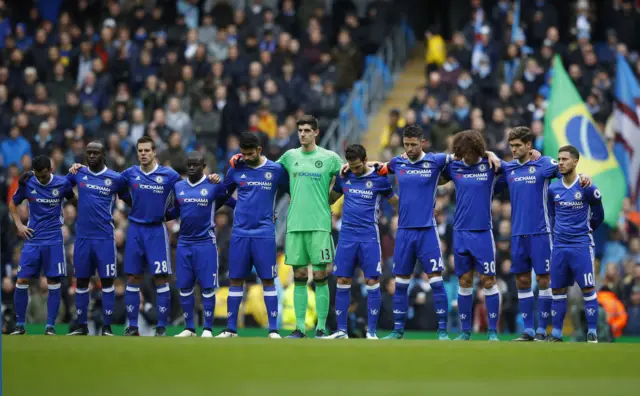 Chelsea players observe a minute's silence ahead of the Manchester City match