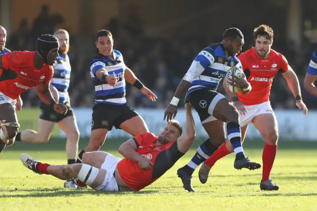 Semesa Rokoduguni of Bath bursts past the challenge of Vincent Koch of Saracens